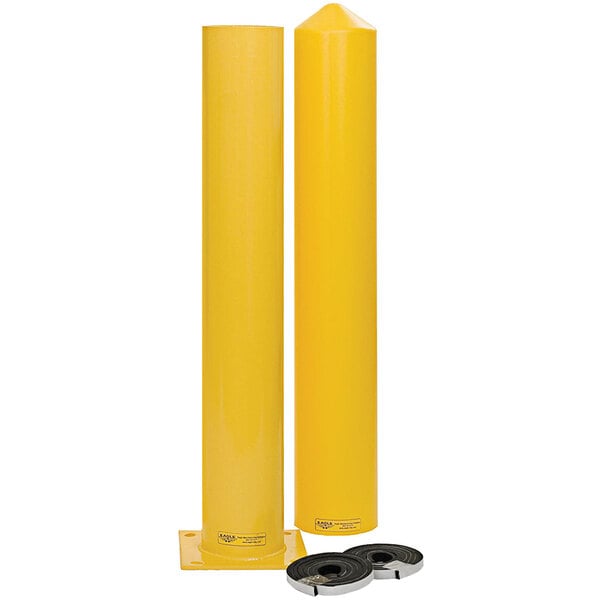 Two Eagle Manufacturing yellow steel bollard posts with black caps.