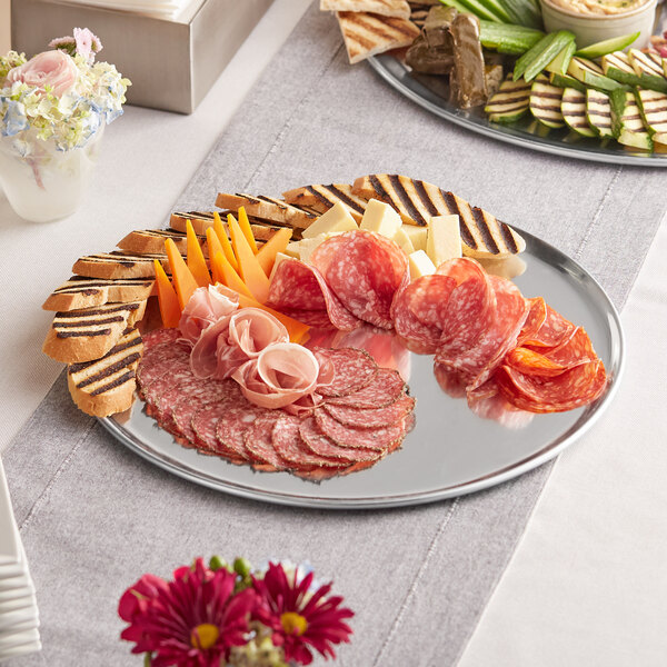 A Choice 15" aluminum pizza pan with meat and cheese on it.