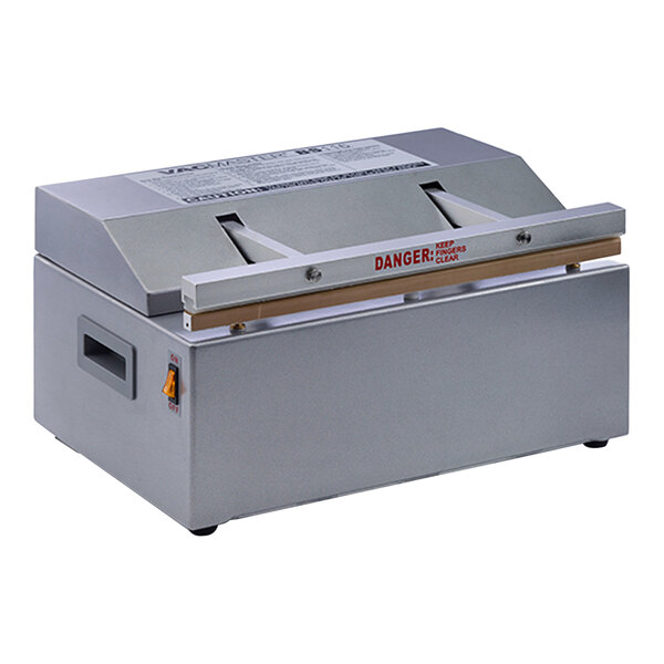 An ARY VacMaster impulse bag sealer with a red label on a counter.