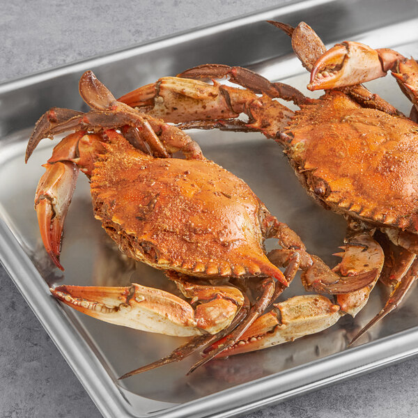A tray of steamed female crabs.