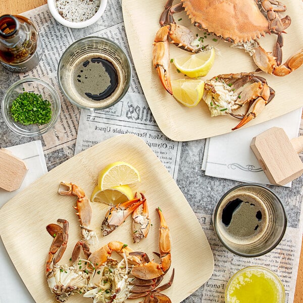 A table with a plate of Chesapeake Blue Crab and lemons.