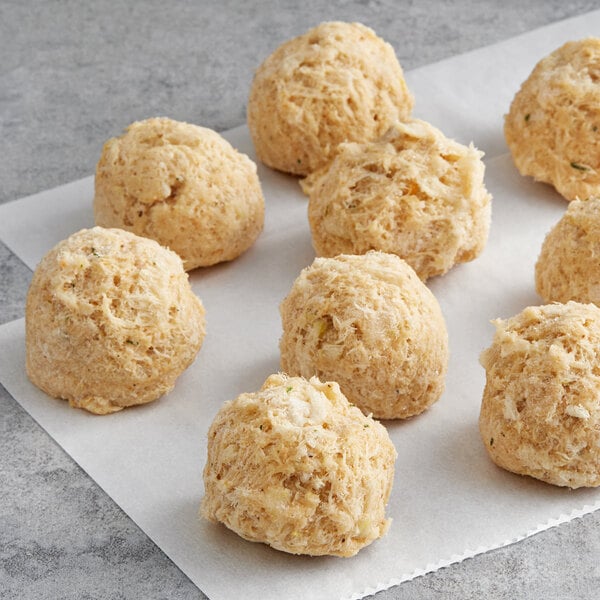 A group of Chesapeake Crab Connection Blue Crab Cakes on a white surface.