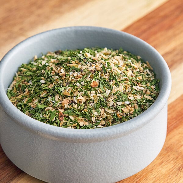 A bowl of Regal Meatloaf Seasoning on a wooden table.