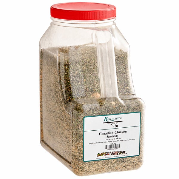 A clear plastic container of Regal Canadian Chicken Seasoning with a red and green label.