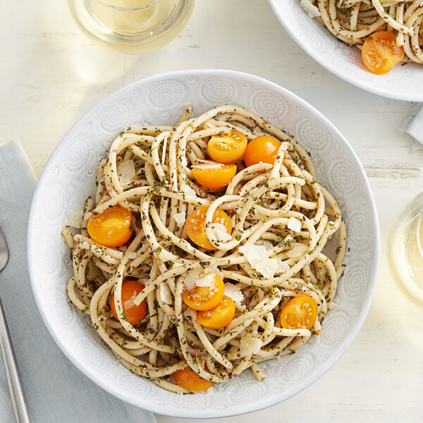 A bowl of spaghetti with tomatoes and Regal Salt-Free Italian Seasoning.
