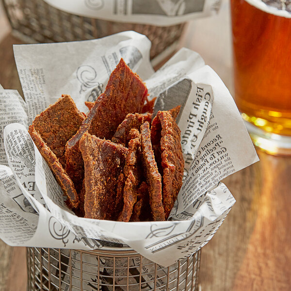 A basket of meat with Regal Original Sweet and Salty Jerky Seasoning.