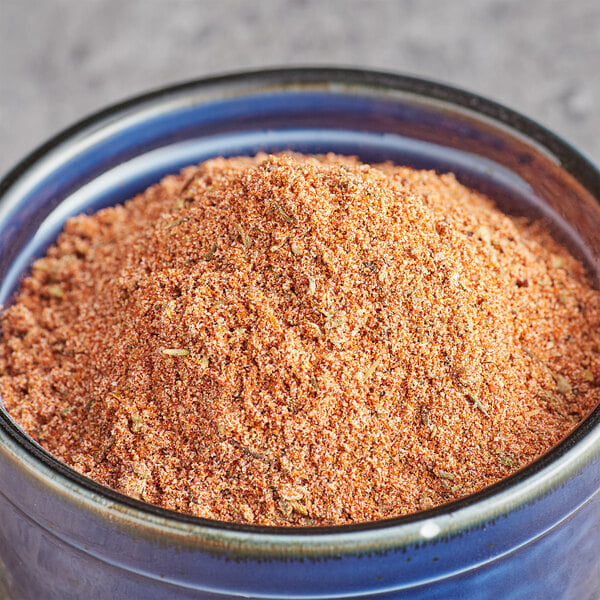 A bowl of Regal Mexican Chorizo Sausage seasoning powder.