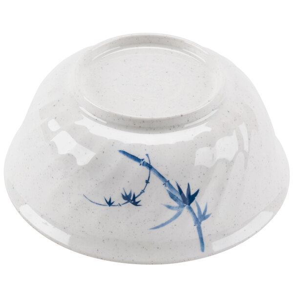 A white bowl with blue and white bamboo design.