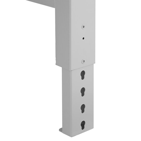 A white rectangular Lavex steel workbench top with holes.