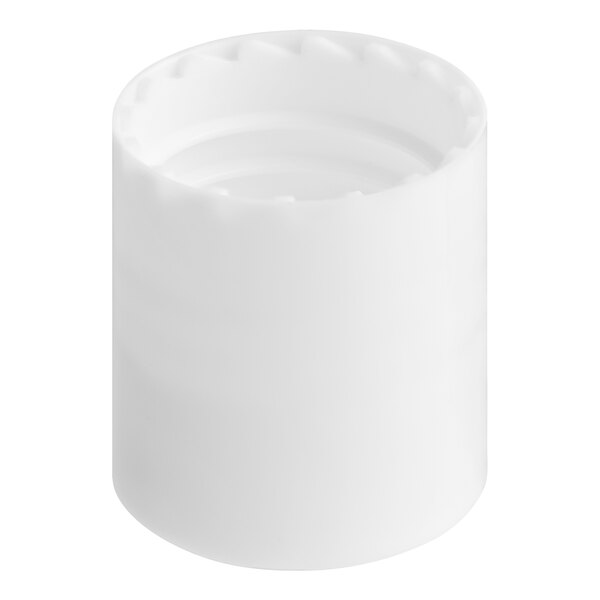 A white plastic bottle cap with a circular pattern on a white surface.