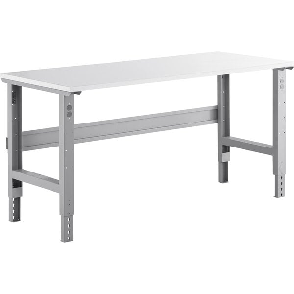 A white rectangular workbench with metal legs and a metal frame.