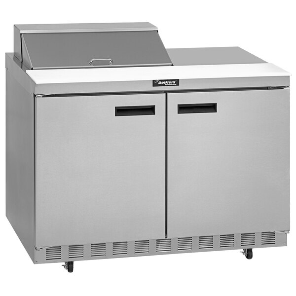 A Delfield stainless steel refrigerator with two doors.