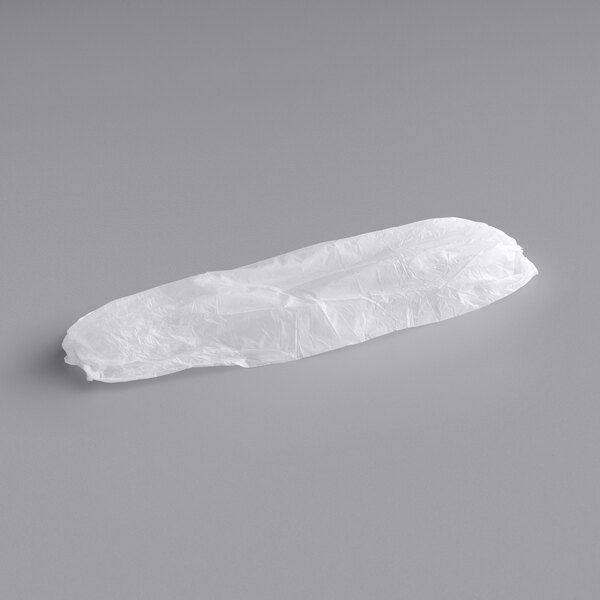 A white polyethylene sleeve in a plastic bag.