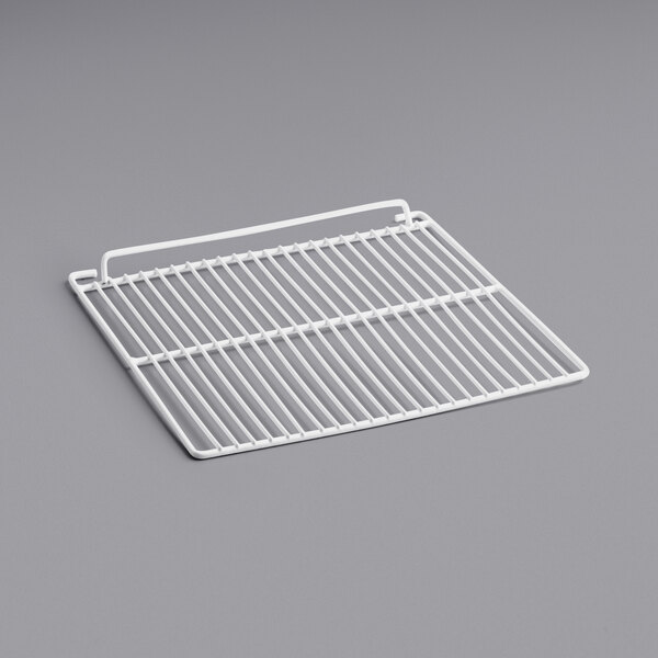 a white wire rack on a gray surface