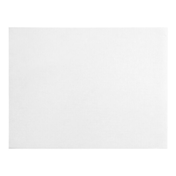 A white rectangular cake board with black lines on the edges on a white background.