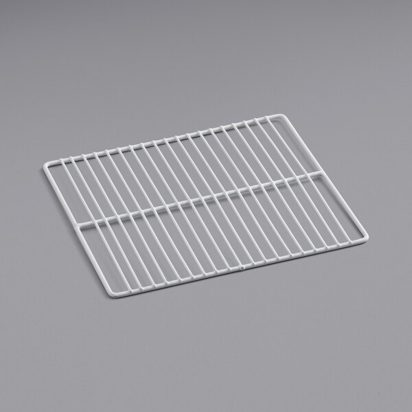 a white wire rack on a gray surface