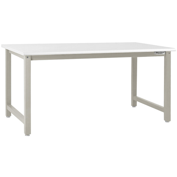 A white BenchPro Kennedy industrial workbench with a gray metal frame and legs.