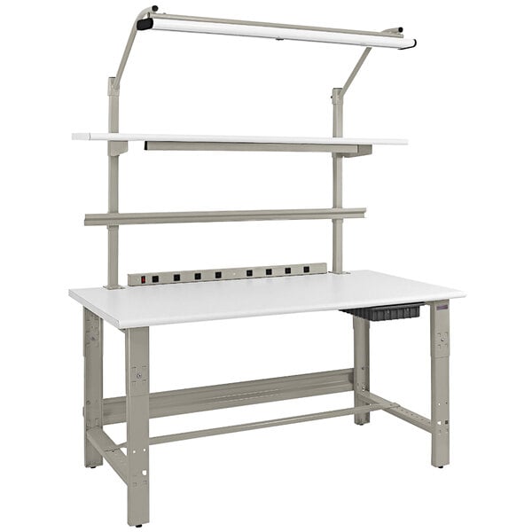 A white rectangular BenchPro workbench with a grey base and a light above it.