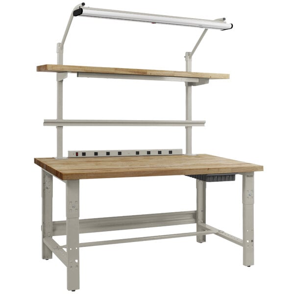 A wooden workbench with a gray metal base and a light on top.