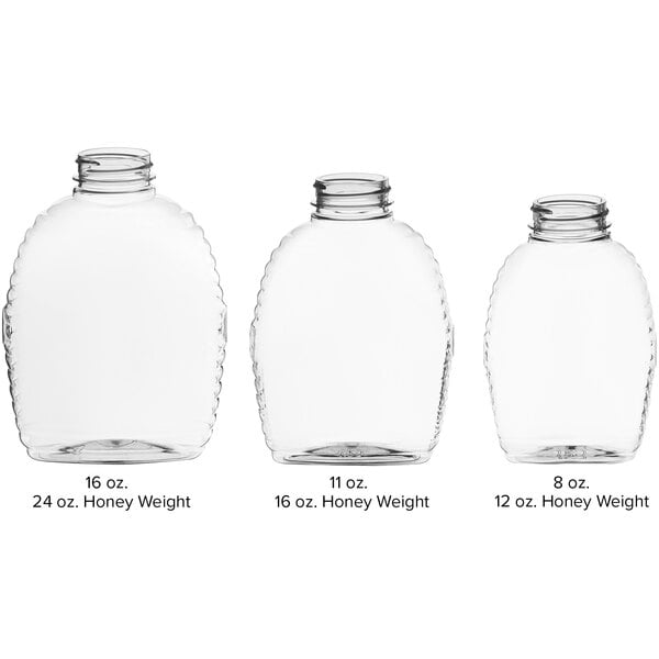 A clear PET Queenline honey bottle with a black lid.