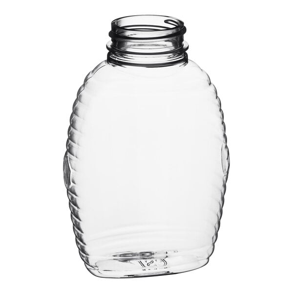 A clear Queenline PET honey jar with a lid.