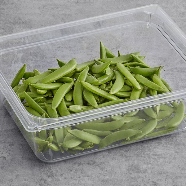 A plastic container filled with Sugar Snap Peas.