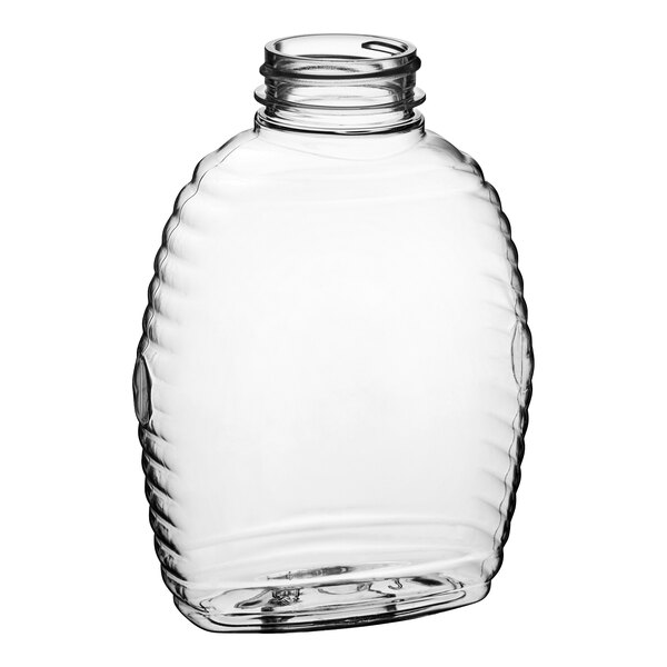A clear PET Queenline honey bottle with a lid.