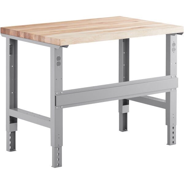 A Lavex workbench with a square maple wood top and metal legs.