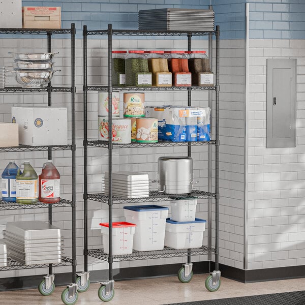 A Steelton black wire shelving kit with casters in a kitchen with food on the shelves.