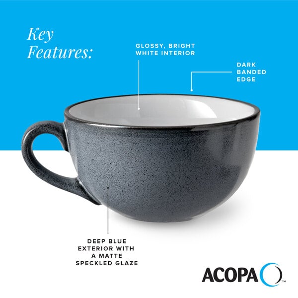 A deep blue matte stoneware cup with a glossy white interior and dark banded edge.