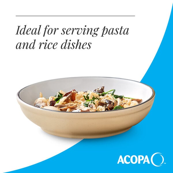 A tan matte stoneware pasta bowl filled with a pasta dish.