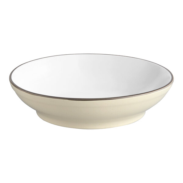 An Acopa cream white stoneware pasta bowl with a brown rim.