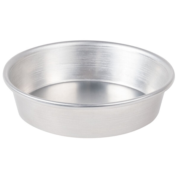 An American Metalcraft aluminum pizza pan with a silver surface.