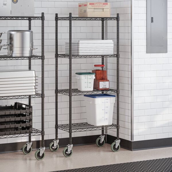 A black epoxy 4-shelf wire shelving unit with casters and 54-inch posts, used for storage.