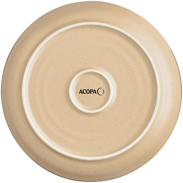 A close up of an Acopa Harvest Tan stoneware plate with a circular design.