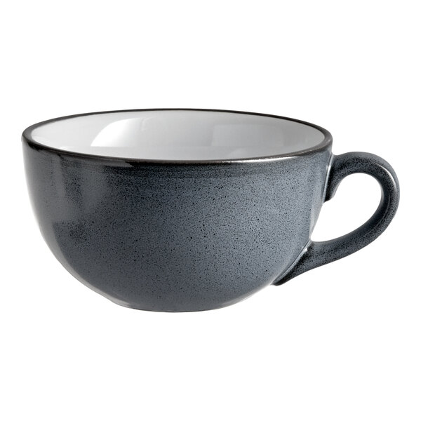 A matte midnight blue stoneware cup with a handle and a white interior.