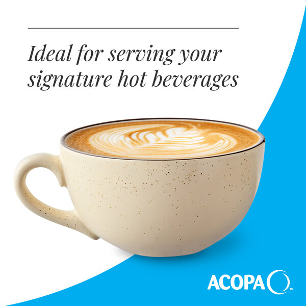A cream white matte stoneware cup filled with a hot beverage, featuring a speckled design.