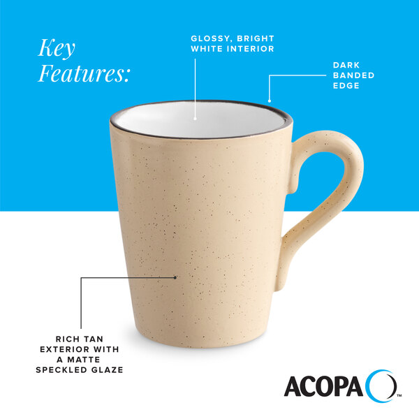 A tan matte stoneware mug with a speckled glaze, glossy white interior, and a dark banded edge.