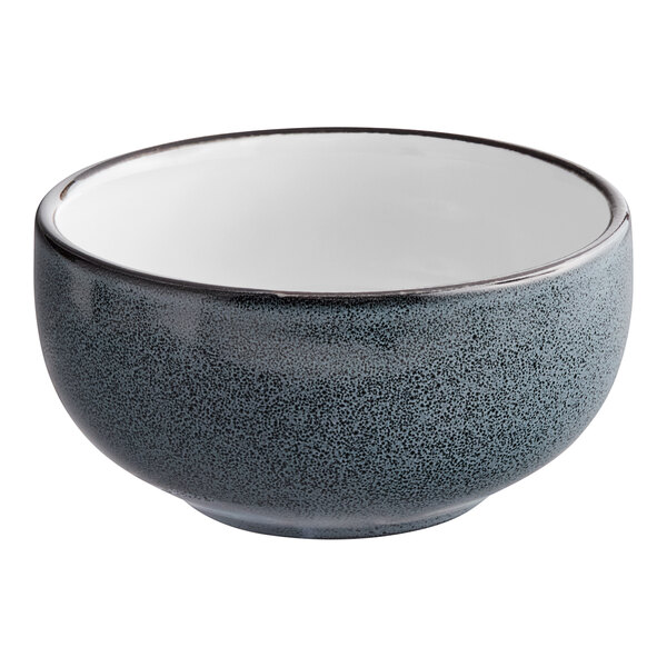 A matte midnight blue stoneware bowl with a black rim.
