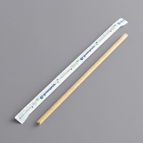 A Greenprint natural agave super jumbo wrapped straw next to a white ruler.
