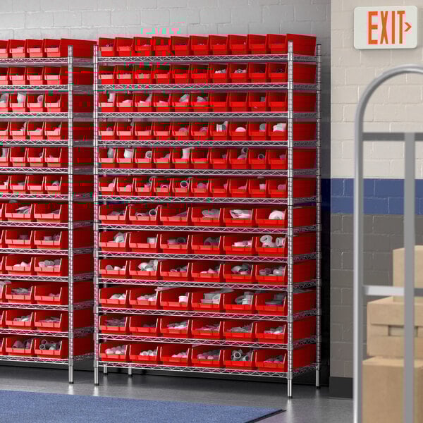 A Regency wire shelving unit with red plastic bins on the shelves.