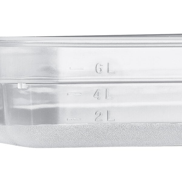 A close-up of a clear plastic Vigor food pan.