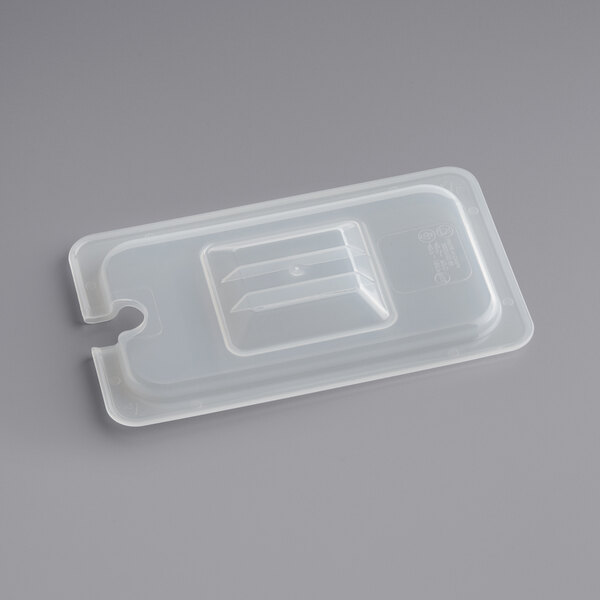 A Vigor translucent polypropylene lid with a notch on a plastic container.