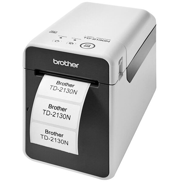 A white and black Brother TD2130NW label printer with labels.