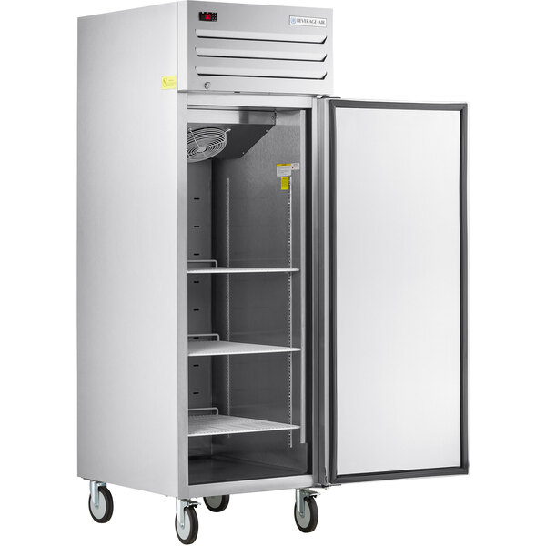 A silver Beverage-Air reach-in freezer with a door open.