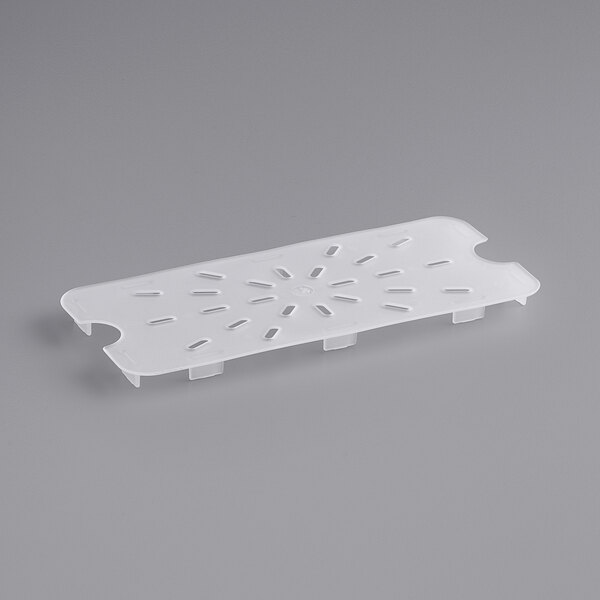 A white translucent polypropylene tray with holes.