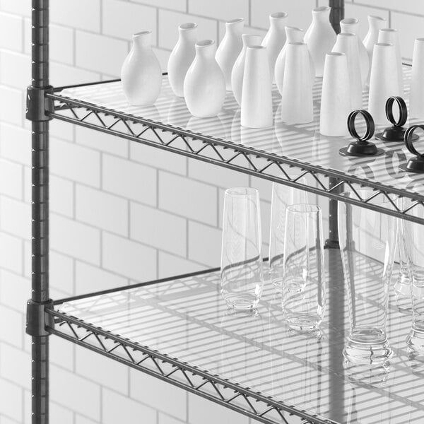 A Regency shelf with white vases and glasses on clear liners.