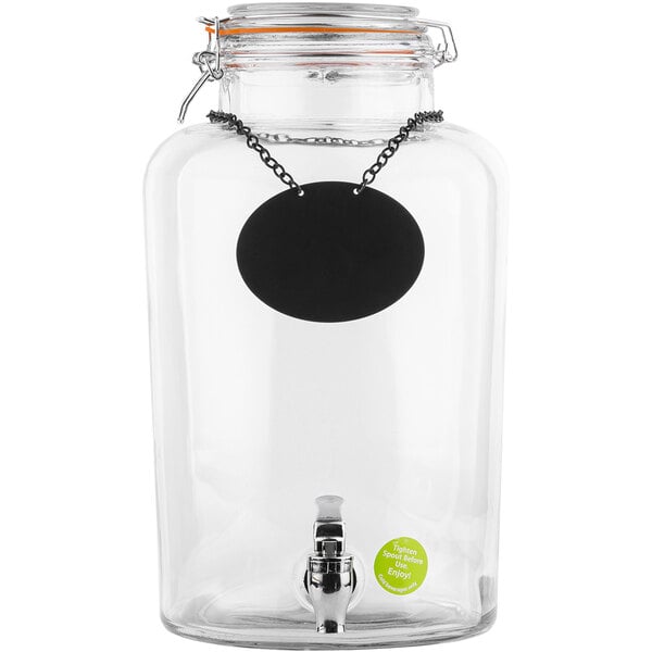 A Tablecraft clear glass beverage dispenser with a black chalkboard label attached to it.