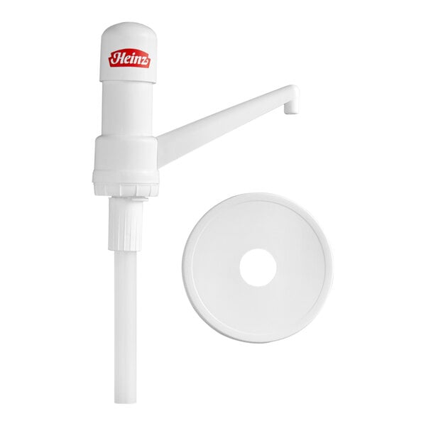 A white plastic condiment pump with a long spout and a separate round lid, featuring a Heinz logo on the top.