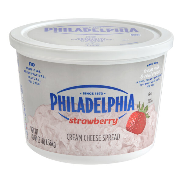 A 3 lb. tub of Philadelphia strawberry cream cheese spread.